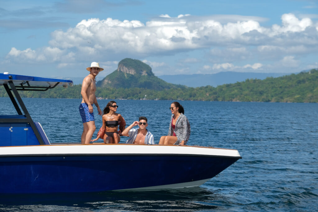 Upscale lakeside estates in Batangas: a group of 4 persons sailing in Taal Lake