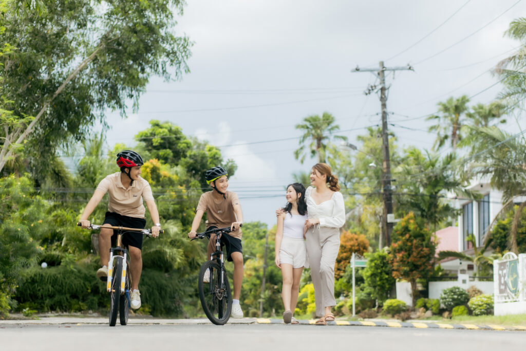 Lifestyle photo: A family biking within a gated community